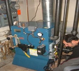 A Boiler Being Serviced by Daves Cooling and Heating 