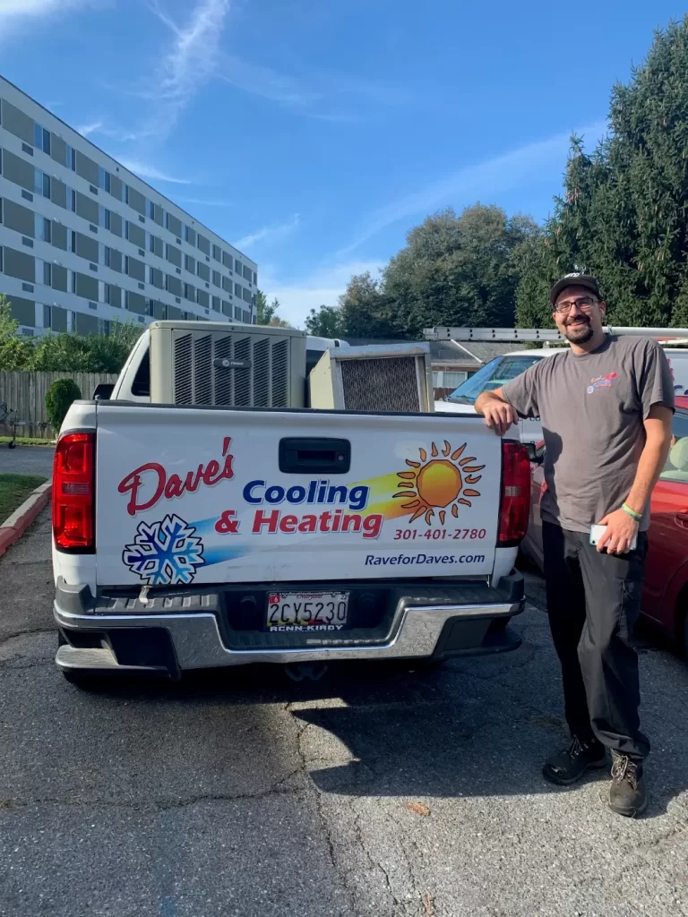 Dave's Cooling and Heating Technician Standing in Front of Truck on Job for Fall HVAC Maintenance in Frederick MD